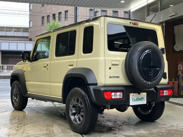 スズキ ジムニー ノマド FC 東京都 2025(令7)年 0.2万km ベージュⅡ 純正メモリナビ(CN-HE02WD)/（TV・Bluetooth・DVD・CD）/バックカメラ/セーフティサポート/・ディユアルカメラブレーキサポート/・誤発進抑制機能/・後退時ブレーキサポート/・後方誤発進抑制機能/・車線逸脱警告機能/・ふらつき警告機能/・先行車発進お知らせ機能/・ハイビームアシスト/・アダクティブクルーズコントロール/・標識認識機能/ワンオーナー /プッシュスタート/アイドリングストップ/フロアマット/シートヒーター /LEDヘッドライト　・フォグランプ/電動格納ミラー/保証書・取扱説明書・スペアキー