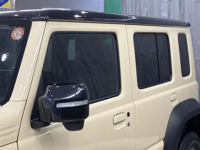 スズキ ジムニー ノマド FC 東京都 2025(令7)年 0.2万km ベージュⅡ 純正メモリナビ(CN-HE02WD)/（TV・Bluetooth・DVD・CD）/バックカメラ/セーフティサポート/・ディユアルカメラブレーキサポート/・誤発進抑制機能/・後退時ブレーキサポート/・後方誤発進抑制機能/・車線逸脱警告機能/・ふらつき警告機能/・先行車発進お知らせ機能/・ハイビームアシスト/・アダクティブクルーズコントロール/・標識認識機能/ワンオーナー /プッシュスタート/アイドリングストップ/フロアマット/シートヒーター /LEDヘッドライト　・フォグランプ/電動格納ミラー/保証書・取扱説明書・スペアキー