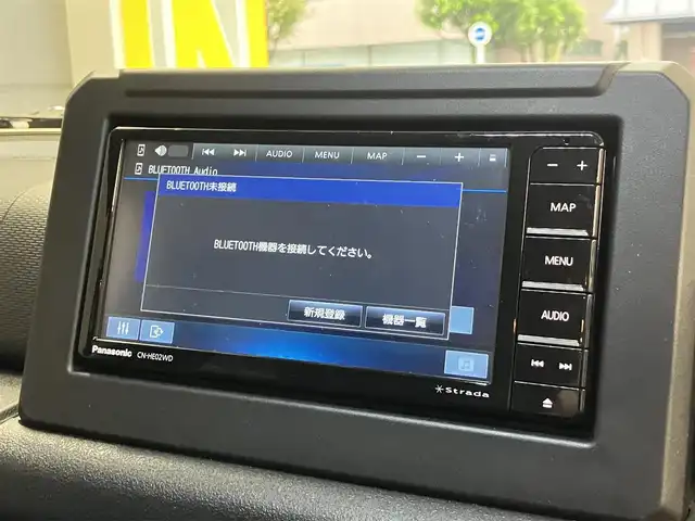 スズキ ジムニー ノマド FC 東京都 2025(令7)年 0.2万km ベージュⅡ 純正メモリナビ(CN-HE02WD)/（TV・Bluetooth・DVD・CD）/バックカメラ/セーフティサポート/・ディユアルカメラブレーキサポート/・誤発進抑制機能/・後退時ブレーキサポート/・後方誤発進抑制機能/・車線逸脱警告機能/・ふらつき警告機能/・先行車発進お知らせ機能/・ハイビームアシスト/・アダクティブクルーズコントロール/・標識認識機能/ワンオーナー /プッシュスタート/アイドリングストップ/フロアマット/シートヒーター /LEDヘッドライト　・フォグランプ/電動格納ミラー/保証書・取扱説明書・スペアキー