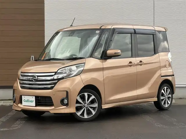 日産 デイズ ルークス ハイウェイスターターボ 秋田県 2016(平28)年 8.3万km ピンクゴールドM ４WD/ターボ/衝突軽減システム/LEDヘッドライト/純正メモリナビ（DVD/CD/BT）/フルセグ/アラウンドビューモニター/日産純正アルミ（夏タイヤ装着）/スマートキー/純正エンジンスターター/アイドリングストップ/プッシュスタート/ステアリングスイッチ/運転席シートヒーター/ETC/純正フロアマット/純正ドアバイザー/オートライト/オートエアコン/パワーステアリング/パワーウィンドウ/電動格納ウィンカーミラー/横滑り防止/盗難防止装置/寒冷地仕様/保証書/取扱説明書/記録簿/スペアキー×１