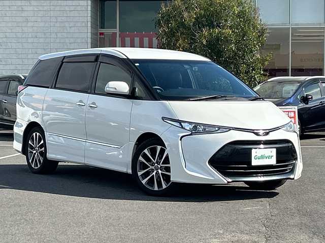 トヨタ エスティマ アエラス プレミアム 鹿児島県 2018(平30)年 10.7万km ホワイトパールクリスタルシャイン フリップダウンモニター/両側パワースライドドア/電動リアゲート/バックカメラ/オットマン/クルーズコントロール/MTモード付AT/パワーシート/フルセグTV/ナビ/ETC/レーンキープアシスト/ハーフレザーシート/純正18インチアルミホイール/プッシュスタート/スマートキー/スペアキー/オートライト/純正フロアマット/衝突被害軽減システム/横滑り防止装置　ワンオーナー