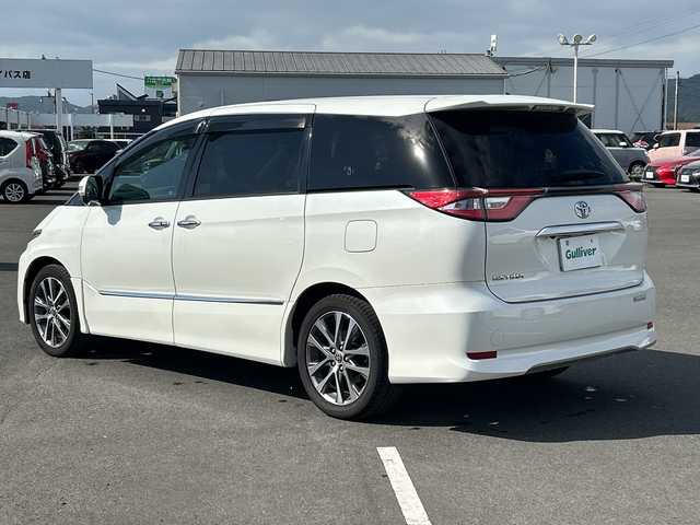 トヨタ エスティマ アエラス プレミアム 鹿児島県 2018(平30)年 10.7万km ホワイトパールクリスタルシャイン フリップダウンモニター/両側パワースライドドア/電動リアゲート/バックカメラ/オットマン/クルーズコントロール/MTモード付AT/パワーシート/フルセグTV/ナビ/ETC/レーンキープアシスト/ハーフレザーシート/純正18インチアルミホイール/プッシュスタート/スマートキー/スペアキー/オートライト/純正フロアマット/衝突被害軽減システム/横滑り防止装置　ワンオーナー