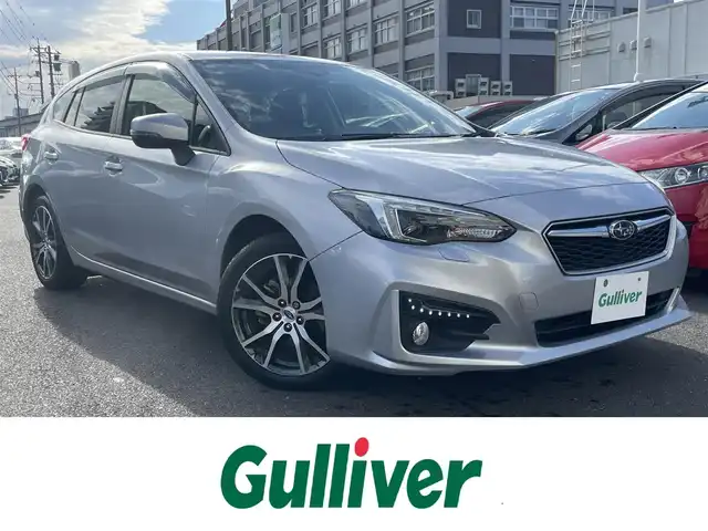 スバル インプレッサ スポーツ 2．0i－L アイサイト 島根県 2019(平31)年 7万km アイスシルバーメタリック 4WD/純正８インチメモリナビ【DIATONEsound】　/(AM/FM/フルセグＴＶ/ＣＤ・ＤＶＤ再生/Ｂｌｕｅｔｏｏｔｈ・USB接続)　/アイサイト/プリクラッシュブレーキ/レーンアシスト　/全車速追従機能付クルーズコントロール　/誤発進抑制機能/リアコーナーセンサー　/電動パーキングブレーキ/オートホールド　/前方ドライブレコーダー　/ＥＴＣ2.0/バックカメラ　/パドルシフト/純正１７インチアルミホイール/純正フロアマット/プッシュスタート/スマートキー/スペアキー/オートライト/フォグランプ/ステアリングスイッチ/アイドリングストップ/電動格納ミラー/シートリフター/トノカバー