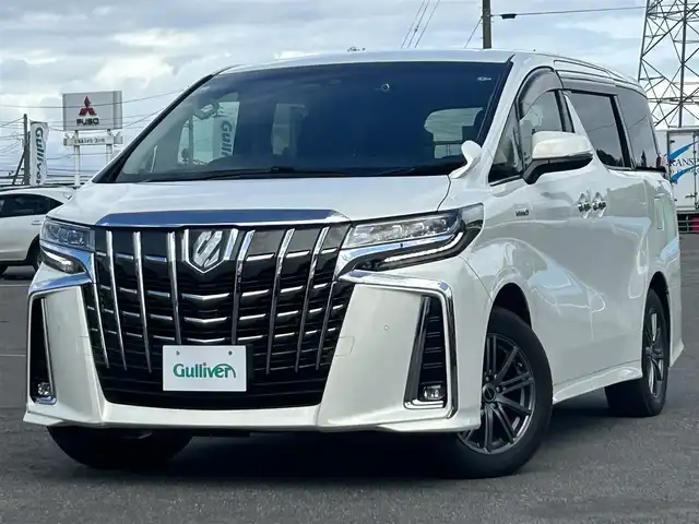 トヨタ アルファードハイブリット SR Cパッケージ 道央・札幌 2021(令3)年 6.4万km ラグジュアリーホワイトパールクリスタルシャインガラスフレーク ４WD/寒冷地仕様/純正メーカーナビ/CD/DVD/USB/BT/純正フリップダウンモニター/トヨタセーフティセンス/プリクラッシュセーフティ/横滑り防止装置/レーダークルーズコントロール/レーンキープアシスト/クリアランスソナー/パーキングサポートブレーキ/ロードサインアシスト/バックカメラ/ビルトインETC2.0/ドライブレコーダー/っ自動防眩ミラー/EVMODE/ECOMODE/ワイパーデアイサー/nanoe/両側パワースライドドア/パワーバックドア/前席/２列目パワーシート/D席メモリーシート/前席シートヒーター/前席エアシート/レザーシート/革巻きウッドコンビステアリング/ステアリングリモコン/ハンドルヒーター/AC100V/電動パーキング/ブレーキホールド/MTモード付AT/プッシュスタート/スマートキー/LEDヘッドライト/オートライト/オートハイビーム/フォグランプ/電動格納ミラー/ウィンカーミラー/純正フロアマット/ドアバイザー/スペアキー