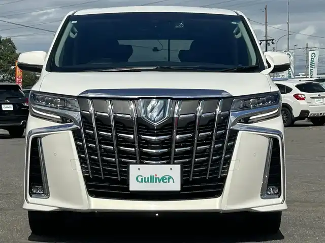 トヨタ アルファードハイブリット SR Cパッケージ 道央・札幌 2021(令3)年 6.4万km ラグジュアリーホワイトパールクリスタルシャインガラスフレーク ４WD/寒冷地仕様/純正メーカーナビ/CD/DVD/USB/BT/純正フリップダウンモニター/トヨタセーフティセンス/プリクラッシュセーフティ/横滑り防止装置/レーダークルーズコントロール/レーンキープアシスト/クリアランスソナー/パーキングサポートブレーキ/ロードサインアシスト/バックカメラ/ビルトインETC2.0/ドライブレコーダー/っ自動防眩ミラー/EVMODE/ECOMODE/ワイパーデアイサー/nanoe/両側パワースライドドア/パワーバックドア/前席/２列目パワーシート/D席メモリーシート/前席シートヒーター/前席エアシート/レザーシート/革巻きウッドコンビステアリング/ステアリングリモコン/ハンドルヒーター/AC100V/電動パーキング/ブレーキホールド/MTモード付AT/プッシュスタート/スマートキー/LEDヘッドライト/オートライト/オートハイビーム/フォグランプ/電動格納ミラー/ウィンカーミラー/純正フロアマット/ドアバイザー/スペアキー