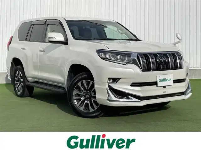 トヨタ ランドクルーザー プラド TX Lパッケージ 香川県 2022(令4)年 2.2万km ホワイトパールクリスタルシャイン トヨタセーフティーセンス/・プリクラッシュ/・LDA/モデリスタエアロ/純正9インチナビ/バックカメラ/ベージュレザーシート/シートヒーター/エアシート/パワーシート/革巻きステアリング/レーダークルーズコントロール/LEDライト/フォグライト/スマートキー/プッシュスタート