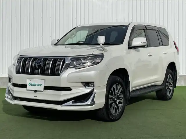 トヨタ ランドクルーザー プラド TX Lパッケージ 香川県 2022(令4)年 2.2万km ホワイトパールクリスタルシャイン トヨタセーフティーセンス/・プリクラッシュ/・LDA/モデリスタエアロ/純正9インチナビ/バックカメラ/ベージュレザーシート/シートヒーター/エアシート/パワーシート/革巻きステアリング/レーダークルーズコントロール/LEDライト/フォグライト/スマートキー/プッシュスタート