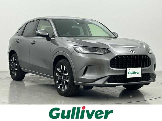 ホンダ ＺＲ－Ｖ ハイブリッド e:HEV Z 熊本県 2023(令5)年 1.6万km スーパープラチナグレーメタリック 禁煙車　/ＢＯＳＥサウンド　/純正ナビ（ＡｐｐｌＣａｒＰｌａｙ・ＡｎｄｒｏｉｄＡｕｔｏ・フルセグ）/全周囲カメラ　/ビルトインＥＴＣ２．０　/衝突軽減ブレーキ/ブラインドスポットモニター/アダブティブクルーズコントロール/先行車発進お知らせ機能/レーンキープアシスト/路外逸脱制御機能/標識認識機能　/横滑り防止/ダウンヒルアシスト/パワーバックドア　/前席シートヒーター/ステアリングヒーター/前席パワーシート/置くだけ充電/パドルシフト/オートライト/LEDヘッドライト/フォグライト/スマートキー/プッシュスタート/スペアキー1本/保証書/取扱説明書