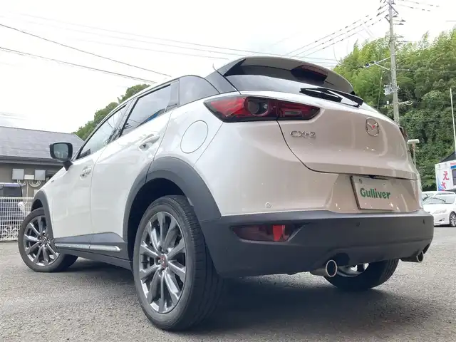 マツダ ＣＸ－３ 15S 100周年特別記念車 長崎県 2020(令2)年 5.9万km スノーフレイクホワイトパールマイカ BOSEサウンド/衝突被害軽減ブレーキ/レーダークルーズコントロール/レーンキープアシスト/メーカーOP・SDナビ/(Bluetooth接続・フルセグTV・DVD再生)/全方位カメラ・バックカメラ/前後ドライブレコーダー/ETC/赤革シート/・パワーシート/・シートヒーター/ステアリングヒーター/コーナーセンサー/横すべり防止装置/ヘッドアップディスプレイ/電子パーキング/オートホールド機能/MTモード付AT/パドルシフト