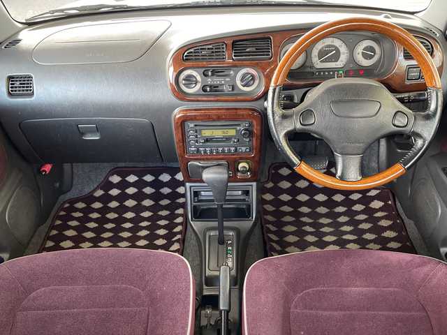 ダイハツ ミラ ジーノ 岐阜県 2000(平12)年 8.7万km ホワイトパールマイカ /純正オーディオ/（AM/FM/CD）//パワーウィンドウ//電動調整ミラー//ドアバイザー//純正フロアマット//エアコン//ベンチシート//エアバック//スタッドレスタイヤホイールセット//木目ハンドル//木目インパネ//紫シート