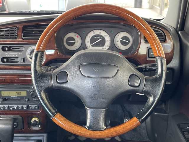 ダイハツ ミラ ジーノ 岐阜県 2000(平12)年 8.7万km ホワイトパールマイカ /純正オーディオ/（AM/FM/CD）//パワーウィンドウ//電動調整ミラー//ドアバイザー//純正フロアマット//エアコン//ベンチシート//エアバック//スタッドレスタイヤホイールセット//木目ハンドル//木目インパネ//紫シート