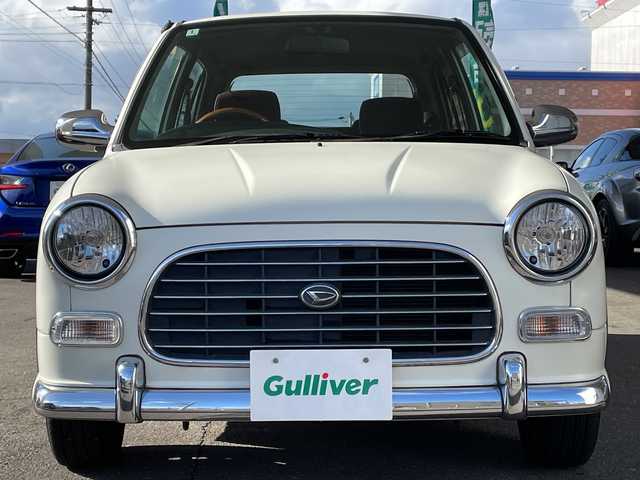 ダイハツ ミラ ジーノ 岐阜県 2000(平12)年 8.7万km ホワイトパールマイカ /純正オーディオ/（AM/FM/CD）//パワーウィンドウ//電動調整ミラー//ドアバイザー//純正フロアマット//エアコン//ベンチシート//エアバック//スタッドレスタイヤホイールセット//木目ハンドル//木目インパネ//紫シート