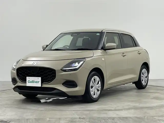 スズキ スイフト XG 群馬県 2024(令6)年 1万km キャラバンアイボリーPM 禁煙車　社外７型ナビ　アダクティブクルーズコントロール　レーンキープアシスト　ブラインドスポットモニター　衝突軽減　オートマチックハイビーム　シートヒーター　コーナーセンサー　LEDヘッドライト