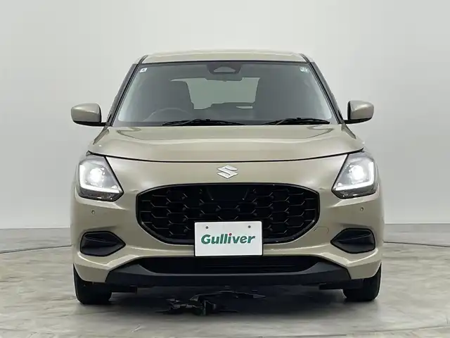 スズキ スイフト XG 群馬県 2024(令6)年 1万km キャラバンアイボリーPM 禁煙車　社外７型ナビ　アダクティブクルーズコントロール　レーンキープアシスト　ブラインドスポットモニター　衝突軽減　オートマチックハイビーム　シートヒーター　コーナーセンサー　LEDヘッドライト