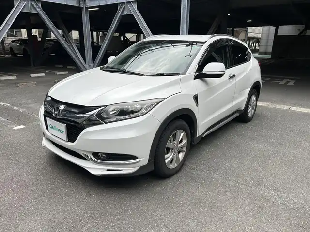 ホンダ ヴェゼル X 静岡県 2014(平26)年 14.2万km ホワイトオーキッドパール 純正ナビ、革巻きハンドル、LEDヘッドライト、純正フロアマット、純正アルミ、Bluetooth、HDDナビ