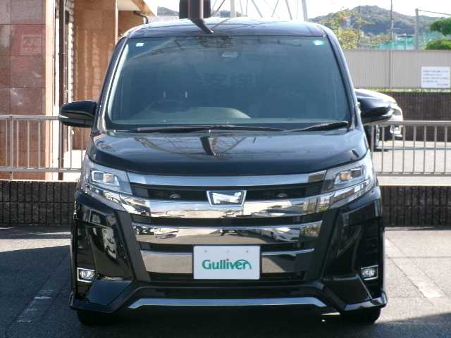 トヨタ ノア Si ダブルバイビーⅡ 長崎県 2019(令1)年 8.6万km ブラック 【 Toyota Safety Sense 】/・プリクラッシュセーフティ/・レーンディパーチャーアラート/・オートマチックハービーム/・先行車発進告知機能/ワンオーナー/純正10インチSDナビ/・フルセグテレビ/・バックカメラ/・Bluetooth/・USB/・DVD再生可能/純正12.1インチフリップダウン/ハーフレザーシート/両側パワースライドドア/クルーズコントロール/クリアランスソナー/オートライト/LEDヘッドライト/オートリトラミラー/シートバックテーブル/リアサンシェード/ビルトインETC/スマートキー2個/純正フロアマット/純正16AW/純正フロアマット