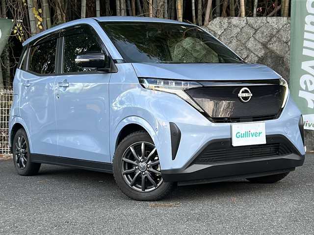 日産 サクラ G 京都府 2023(令5)年 2万km ライトブルー 純正ナビ/・フルセグTV/BT Audio/バック/サイド/フロントカメラ/アラウンドビューモニター/レーダークルーズコントロール/プロパイロット/ETC/前後ドライブレコーダー/エマージェンシーブレーキ/パーキングアシスト/デジタルインナーミラー/e-pedal/コーナーセンサー/シートヒーター/ステアリングヒーター/ステアリングスイッチ/電動パーキングブレーキ/ブレーキホールド/プッシュスタート/純正ドアバイザー/純正フロアマット/純正サマータイヤ4本車載/充電コード/保証書＆取説/ナビ取説/スマートキースペア