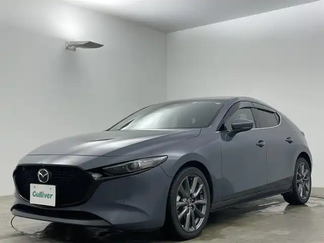マツダ マツダ３ファストバック 20S プロアクティブ ツーリングS 岡山県 2020(令2)年 5.3万km ポリメタルグレーM 純正メモリナビ/(CD/DVD/Bluetooth/フルセグ/HDMI/USB)/衝突軽減ブレーキ/全方位カメラ/追従型クルーズコントロール/ビルトインETC/シートヒーター/LEDヘッドライト/前後ドライブレコーダー/運転席パワシート/シートメモリー/ブラインドスポットモニター/コーナーセンサー（前後）/オートハイビーム/プッシュスタート/スマートキー/スペアキー/アイドリングストップ/純正フロアマット/社外ドアバイザー