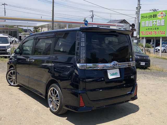 トヨタ ヴォクシー ハイブリッド ZS 煌Ⅱ 福島県 2017(平29)年 5万km ブラッキッシュアゲハガラスフレーク ワンオーナー/社外メモリナビ/・EX10　/CD、DVD、BT、MSV、フルセグTV/トヨタセーフティセンス/バックカメラ/ビルトインETC/ステアリングリモコン/スマートキー/プッシュスタート/モデリスタフロントスポイラー/両側パワースライドドア/オートライト/LEDライト/フォグランプ/社外18インチアルミホイール/保証書/取扱説明書