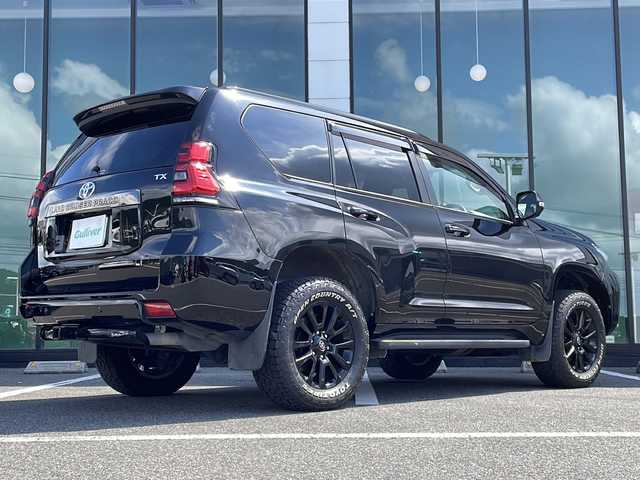 トヨタ ランドクルーザー プラド TX-L 70thアニバーサリーLTD 福岡県 2021(令3)年 6.4万km ブラック ワンオーナー/メーカーオプションナビ/（フルセグTV BT Miracast AM FM)/サンルーフ/BSM/アラウンドビューモニター/ビルトインETC/パワーシート/エアーシート/シートヒーター/純正ドアバイザー/純正フロアマット/純正18インチAW/ドラレコ（COMTEC HDR361GW)/レーダークルーズコントロール/オートライト/ヘッドライトウォッシャー/牽引装置