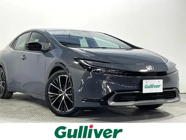 トヨタ プリウス Z 大阪府 2024(令6)年 1.3万km グレー トヨタチームメイト アドバンストパーク 黒革シート 純正12.3incナビTV 360カメラ デジタルインナーミラー パワーシート/ヒーター/エアコン ステアリングヒーター 電動リアゲート レーダーC 衝突軽減ブレーキ BSM