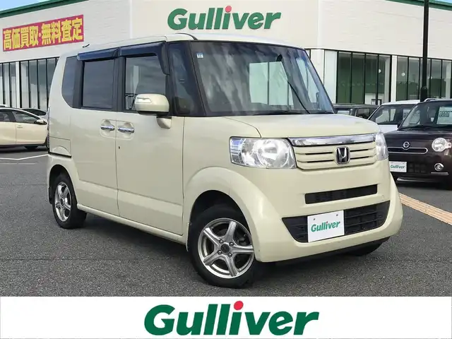ホンダ Ｎ ＢＯＸ G SSパッケージ 鳥取県 2013(平25)年 10.8万km ヒダマリアイボリーパール ４・W・D/純正CDオーディオ/両側パワースライドドア/横滑り防止装置/プッシュエンジンスタート/アイドリングストップ/ウィンカーミラー/電動格納ミラー/ステアリングスイッチ/社外１４インチアルミ/オートエアコン/フロアマット/ドアバイザー