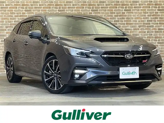 スバル レヴォーグ STIスポーツ EX ブラックインテリアセレ 岩手県 2024(令6)年 1.8万km マグネタイトグレーメタリック ・４WD/・純正メモリナビ（AppleCarplay/AndroidAuto/BT/USB/AUX/AM//FM/フルセグテレビ）/・アイサイトX/・渋滞時ハンズオフアシスト/・アクティブレーンチェンジアシスト/・ドライバー異常時対応システム/・カーブ前速度制御/・アラウンドビューモニター/・純正デジタルインナーミラー/・純正ドライブレコーダー前後/・ハーフレザーシート/・純正フロアマット/・パワーシート（運転席・助手席）/・横滑り防止機能/・LEDライト/・コーナーセンサー前後/・パワーバックドア/・パドルシフト/・プリクラッシュブレーキ/・車間距離警報/・エマージェンシーレーンキープアシスト/・車線逸脱防止機能/・後側方警戒支援システム/・ビークルダイナミクスコントロール/・ステアリング連動ヘッドランプ/・アイドリングストップ/・STI専用ステアリング