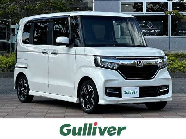 ホンダ Ｎ ＢＯＸ カスタム G L ターボ ホンダセンシング 福島県 2017(平29)年 4.2万km プレミアムホワイトパールⅡ ホンダセンシング/衝突軽減ブレーキ〈CMBS〉/誤発進抑制機能/後方誤発進抑制機能/歩行者事故低減ステアリング/路外逸脱抑制機能/アダプティブクルーズコントロール〈ACC〉/車線維持支援システム〈LKAS〉/オートハイビーム/先行車発進お知らせ機能/標識認識機能/社外ナビゲーション/型番：MDV-Z704/【CD/DVD/SD/BT/TV】/バックカメラ/ドライブレコーダー/ビルトインETC/両側電動スライドドア/パドルシフト/ステアリングリモコン/LEDオートライト/LEDフォグランプ/リアドアサンシェード/ドアバイザー