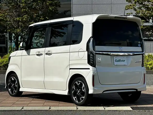 ホンダ Ｎ ＢＯＸ カスタム G L ターボ ホンダセンシング 福島県 2017(平29)年 4.2万km プレミアムホワイトパールⅡ ホンダセンシング/衝突軽減ブレーキ〈CMBS〉/誤発進抑制機能/後方誤発進抑制機能/歩行者事故低減ステアリング/路外逸脱抑制機能/アダプティブクルーズコントロール〈ACC〉/車線維持支援システム〈LKAS〉/オートハイビーム/先行車発進お知らせ機能/標識認識機能/社外ナビゲーション/型番：MDV-Z704/【CD/DVD/SD/BT/TV】/バックカメラ/ドライブレコーダー/ビルトインETC/両側電動スライドドア/パドルシフト/ステアリングリモコン/LEDオートライト/LEDフォグランプ/リアドアサンシェード/ドアバイザー