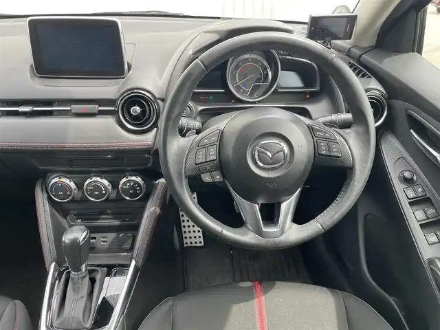 マツダ デミオ 富山県 2015(平27)年 7.4万km グレー ４ＷＤ／/マツダコネクトナビ／/フルセグＴＶ／/Ｂｌｕｅｔｏｏｔｈ／/ＤＶＤ再生／/ビルトインＥＴＣ／/クルーズコントロール／/ブラインドスポットモニター／/ヘッドアップディスプレイ／/衝突軽減ブレーキ／/ＬＥＤオートライト/ＬＥＤフォグライト