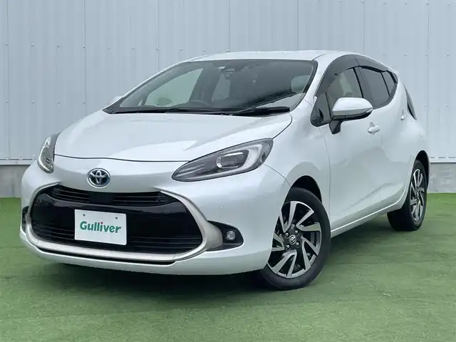 トヨタ アクア Z 香川県 2021(令3)年 3.3万km プラチナホワイトパールマイカ 登録時走行距離：32374km/メーカー純正10.5型ナビ/バックカメラ/ビルトインETC/プリクラッシュセーフティシステム/レーダークルーズコントロール　/前後コーナーセンサー/ＬＥＤオートライト/オートハイビーム　/フォグランプ　/ＡＣ１００Ｖ充電　/電格ウィンカーミラー　/純正16インチアルミホイール/プッシュスタート/スマートキー/ステアリングリモコン　/革巻きステアリング　