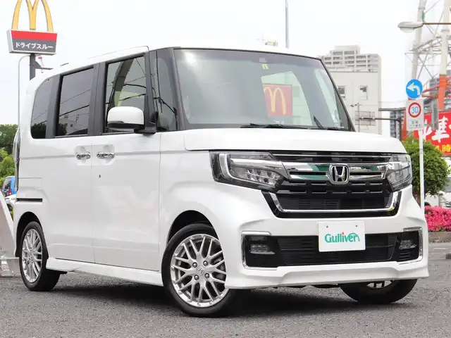 ホンダ Ｎ ＢＯＸ カスタム L ターボ 神奈川県 2023(令5)年 1万km プラチナホワイトパール ホンダセンシング（安全運転支援システム）/両側パワースライドドア/LEDヘッドランプ/：オートヘッドライト/：LEDフロントフォグランプ/純正15インチアルミホイール/ハーフシェイドフロントウィンドウ/：ロールサンシェード/パドルシフト/シートヒーター（前席）/ーーーーーーーーーーーーーーーーーーーーーーー/保証書/取扱説明書/ナビ取説/スペアスマートキー×1本