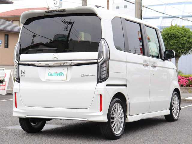 ホンダ Ｎ ＢＯＸ カスタム L ターボ 神奈川県 2023(令5)年 1万km プラチナホワイトパール ホンダセンシング（安全運転支援システム）/両側パワースライドドア/LEDヘッドランプ/：オートヘッドライト/：LEDフロントフォグランプ/純正15インチアルミホイール/ハーフシェイドフロントウィンドウ/：ロールサンシェード/パドルシフト/シートヒーター（前席）/ーーーーーーーーーーーーーーーーーーーーーーー/保証書/取扱説明書/ナビ取説/スペアスマートキー×1本