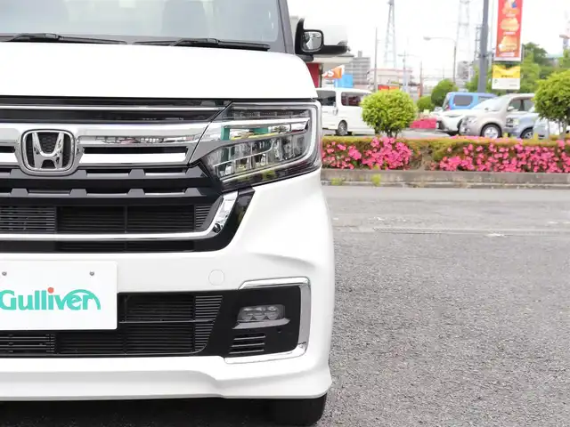 ホンダ Ｎ ＢＯＸ カスタム L ターボ 神奈川県 2023(令5)年 1万km プラチナホワイトパール ホンダセンシング（安全運転支援システム）/両側パワースライドドア/LEDヘッドランプ/：オートヘッドライト/：LEDフロントフォグランプ/純正15インチアルミホイール/ハーフシェイドフロントウィンドウ/：ロールサンシェード/パドルシフト/シートヒーター（前席）/ーーーーーーーーーーーーーーーーーーーーーーー/保証書/取扱説明書/ナビ取説/スペアスマートキー×1本