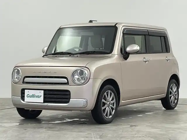 スズキ ラパン ショコラ X 群馬県 2014(平26)年 7.5万km シャンパンピンクPM 社外ディスプレイオーディオ　ＨＩＤライト　オートライト　ラパンショコラ専用シート　社外１４インチアルミホイール　純正フロアマット　ＥＴＣ　スマートキー　オートエアコン　横滑り防止装置　禁煙車