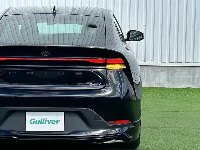 トヨタ プリウス U 香川県 2023(令5)年 2.4万km アティチュードブラックマイカ 純正オーディオ/→AM/FM/Bluetooth/フルセグTV/モデリスタエアロ/バックカメラ/レーダークルーズコントロール/レーンキープアシスト/ビルトイン2.0ETC/オートハイビーム/LEDヘッドライト/シートヒーター/純正フロアマット/ステアリングスイッチ/革巻きステアリング/プッシュスタート/スマートキー/コーナーセンサー/前後ドライブレコーダー