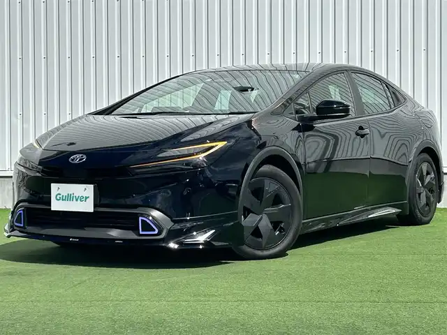 トヨタ プリウス U 香川県 2023(令5)年 2.4万km アティチュードブラックマイカ 純正オーディオ/→AM/FM/Bluetooth/フルセグTV/モデリスタエアロ/バックカメラ/レーダークルーズコントロール/レーンキープアシスト/ビルトイン2.0ETC/オートハイビーム/LEDヘッドライト/シートヒーター/純正フロアマット/ステアリングスイッチ/革巻きステアリング/プッシュスタート/スマートキー/コーナーセンサー/前後ドライブレコーダー