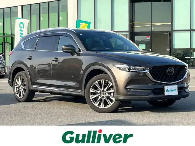 マツダ ＣＸ－８ XD Lパッケージ 奈良県 2022(令4)年 1.2万km チタニウムフラッシュマイカ 純正10.25インチナビ/（フルセグ/BT/CD/DVD）/BOSEプレミアムサウンドシステム/レーダークルーズコントロール/アラウンドビューモニター/ブラインドスポットモニター/前後コーナーセンサー/プリクラッシュセーフティ/レーンキープアシスト/パワーバックドア/レザーシート（レッド）/運転席メモリーシート/前席パワーシート/全席シートヒーター/ステアリングヒーター/ヘッドアップディスプレイ/ワイヤレス充電/後席サンシェード/ETC/前後ドライブレコーダー（ZDR-016）/純正19インチAW/取り扱い説明書/スペアキーX1