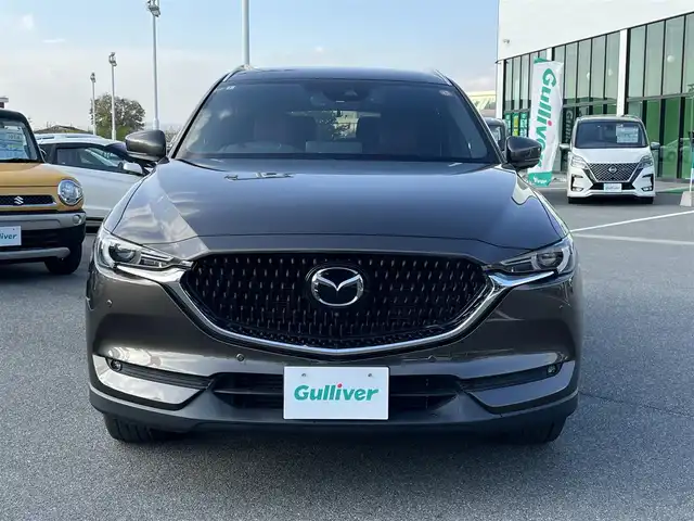 マツダ ＣＸ－８ XD Lパッケージ 奈良県 2022(令4)年 1.2万km チタニウムフラッシュマイカ 純正10.25インチナビ/（フルセグ/BT/CD/DVD）/BOSEプレミアムサウンドシステム/レーダークルーズコントロール/アラウンドビューモニター/ブラインドスポットモニター/前後コーナーセンサー/プリクラッシュセーフティ/レーンキープアシスト/パワーバックドア/レザーシート（レッド）/運転席メモリーシート/前席パワーシート/全席シートヒーター/ステアリングヒーター/ヘッドアップディスプレイ/ワイヤレス充電/後席サンシェード/ETC/前後ドライブレコーダー（ZDR-016）/純正19インチAW/取り扱い説明書/スペアキーX1