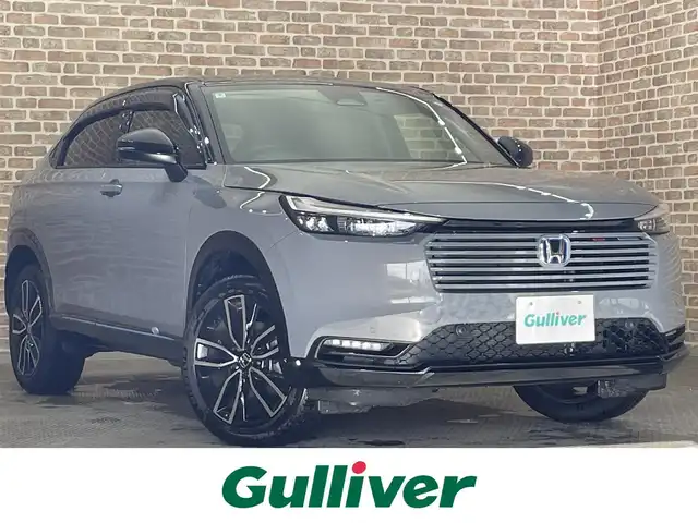 ホンダ ヴェゼル ハイブリッド e:HEV Z PLaYパッケージ 岩手県 2024(令6)年 0.8万km グレー ストレートグレー・パール(NH912P)/４WD/ヒルディセントコントロール/ハンズフリーアクセスパワーテールゲート/ワイヤレス充電/ホンダセンシング/衝突軽減ブレーキ/渋滞追従機能付きアダプティブクルーズコントロール/渋滞運転支援機能/車線維持支援機能/アダプティブドライビングビーム/標識認識機能/先行車発進お知らせ機能/ブラインドスポットインフォメーション/後退出庫サポート/パーキングセンサー/横滑り防止装置/減速セレクター/シートヒーター/ステアリングヒーター/純正ナビ/フルセグTV/ドライブレコーダー/バックカメラ/ETC2.0/LEDヘッドライト/LEDフォグライト/純正18インチアルミホイール