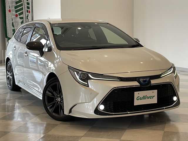 トヨタ カローラツーリング ハイブリッド ダブルバイビー 福井県 2020(令2)年 6.4万km ホワイトパールクリスタルシャイン ワンオーナー/純正7インチディスプレイオーディオ/バックカメラ/トヨタセーフティセンス/・プリクラッシュセーフティ/・レーントレーシングアシスト/・レーダークルーズコントロール/・リヤクロストラフィックアラート/・パーキングサポートブレーキ/・オートマチックハイビーム/・ロードサインアシスト/・先行車発進アラーム/ブラインドスポットモニター/コーナーセンサー/ETC/前後ドライブレコーダー/オプティトロンメーター/オートライト/丸型1灯式LEDヘッドランプ/LEDデイライト/ハーフレザーシート/純正17インチアルミホイール/プッシュスタート/スマートキー×2/純正フロアマット