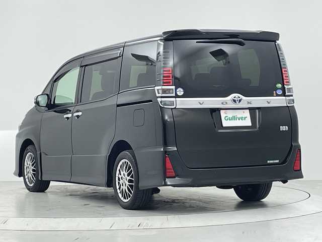 トヨタ ヴォクシー ハイブリッド ZS 煌Ⅲ 大阪府 2021(令3)年 2.9万km イナズマスパーキングブラックガラスフレーク トヨタセーフティセンス/・衝突軽減ブレーキ/純正１０型ナビ/（CD/DVD/Bluetooth/フルセグTV）/バックカメラ/両側パワースライドドア/ハーフレザーシート/前席シートヒーター/ＥＴＣ２．０/ＬＥＤヘッドライト/フォグランプ/コーナーセンサー/クルーズコントロール