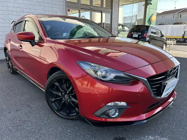 マツダ アクセラ スポーツ 20S ツーリング 埼玉県 2015(平27)年 1.7万km ソウルレッドプレミアムメタリック ワンオーナー/純正ナビオーディオ/(AM/FM/BT/AUX/USB)/バックカメラ/ETC/純正ETCボックス/RVM/LDWS/AFS/HBC/SCBS/バーグラアラームシステム/ヘッドアップディスプレイ/クルーズコントロール（追従無し）/前後ドライブレコーダー　/アイドリングストップ/オートライト/オートエアコン/プッシュスタートボタン/スマートキー×１/ステアリングスイッチ/USB入力端子/純正フロアマット/Auto exeフルスポイラー/Auto exe リアウィング/純正アルミ黒塗装/EXART マフラー/車両/ナビ 取扱説明書/保証書