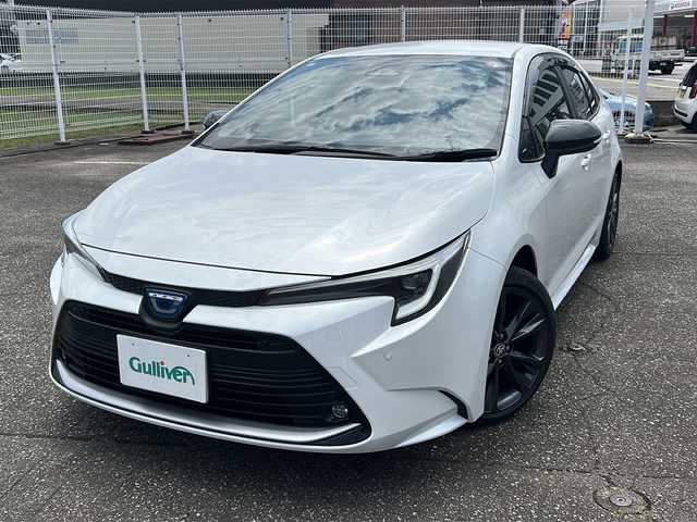 トヨタ カローラ ハイブリット ダブルバイビー 富山県 2023(令5)年 0.4万km プラチナホワイトパールマイカ ワンオーナー/スマートキー（２本）/ハーフレザーシート/4WD/メーカーオプションナビ/衝突安全ブレーキ/フルセグTV/Bluetooth/ビルトインETC2.0/純正17インチAW/ACC/レーンキープアシスト/シートヒーター（D/N）/LEDヘッドライト/フォグランプ/純正フロアマット/純正ドアバイザー/横滑り防止装置/電動パーキングブレーキ/電動格納ウィンカーミラー/ハンドルヒーター/ブラインドスポットモニター/モデリスタスカッフプレート