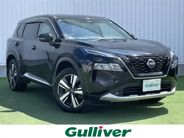 日産 エクストレイル G e－4ORCE 香川県 2023(令5)年 1.8万km ダイヤモンドブラック プロパイロット/純正12.3インチナビ/BOSE/アラウンドビュー/バックカメラ/レザーシート/パワーシート/シートヒーター/革巻きステアリング/ステアリングヒーター/ステアリングリモコン/パーキングアシスト/LEDライト/パワーバックドア/ワイヤレス充電/AC充電/電動パーキング/スマートキー/プッシュスタート