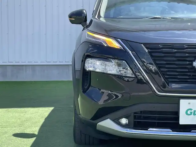 日産 エクストレイル G e－4ORCE 香川県 2023(令5)年 1.8万km ダイヤモンドブラック プロパイロット/純正12.3インチナビ/BOSE/アラウンドビュー/バックカメラ/レザーシート/パワーシート/シートヒーター/革巻きステアリング/ステアリングヒーター/ステアリングリモコン/パーキングアシスト/LEDライト/パワーバックドア/ワイヤレス充電/AC充電/電動パーキング/スマートキー/プッシュスタート