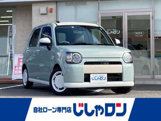 ダイハツ ミラ トコット X SA Ⅲ 静岡県 2018(平30)年 10.3万km セラミックグリーンM (株)IDOMが運営する【じしゃロン焼津店】の自社ローン対象車両になります。こちらは現金ご利用時の価格です。/自社ローンご希望の方は別途その旨お申付け下さい。/純正ＳＤナビ/（フルセグＴＶ/Ｂｌｕｅｔｏｏｔｈ接続/ＣＤ/ＤＶＤ/ミュージックサーバー）/衝突軽減ブレーキ/バックカメラ/前後コーナーセンサー/ＥＴＣ/ＬＥＤヘッドライト/オートハイビーム
