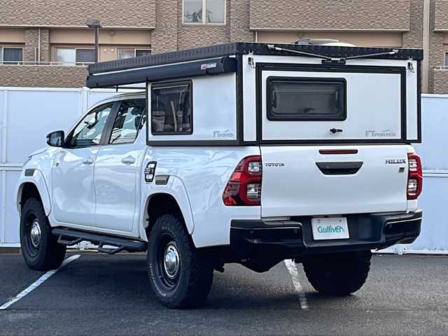 トヨタ ハイラックス Z GRスポーツ 秋田県 2024(令6)年 5万km スーパーホワイトⅡ オーバーランドスタイルキャンパー：FTPORTR 125/・垂直ポップアップルーフ/・スライドベッド/・デッキベッド/・LED室内照明/・シャワー蛇口＆シンク/・ロールブラインド＆ロール網戸付きサイドウィンド/FTPORTERオプション/・パイプガード/・エッジガード/・MAXXFAN7500K（リモコン付き）/・増設ウィンド：リアゲート/・増設ウィンド：フロントウィンド（小）/・ARB4x4：LED付きオーニング（ハードケースブラック）/・純正キャビンリアガラス：スライドウィンドに交換済/・LINE-Xスプレーオンベッドライナー/・ゴールゼロ：YETI 1000X 120Vポータブルバッテリー/リフトアップ：フロント2.5インチ/リア1インチ/社外サイドステップ/純正ディスプレイオーディオ/AM/FM/BT/USB/Miracast/パノラミックビュー/レーダークルーズコントロール/プリクラッシュセーフティ/クリアランスソナー/リアデフロック/アイドリングストップ/パドルシフト/ハーフレザーシート/パワーシート/オートライト/LEDヘッドライト/プッシュスタート/フロアマット/ETC