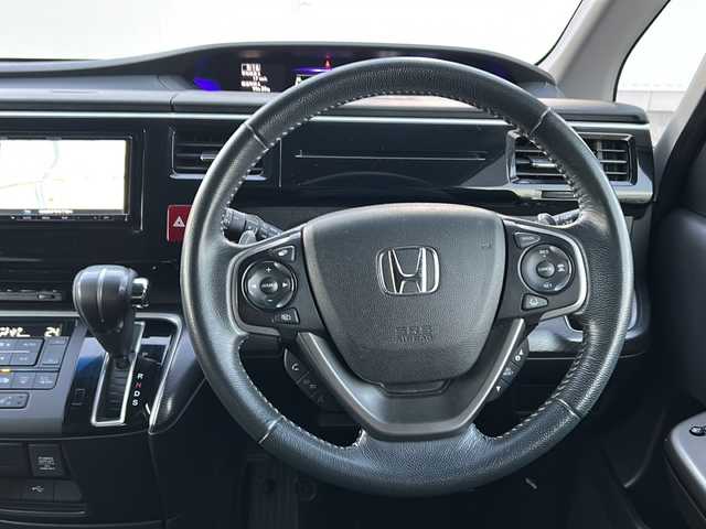 ホンダ ステップワゴン 愛媛県 2019(令1)年 8.8万km プラチナホワイトパール ホンダセンシング/フリップダウンモニター/SDナビ/BT/CD/DVD/フルセグTV/ハーフレザーシート/衝突被害軽減システム/両側パワースライドドア/バックカメラ/追従クルコン/パドルシフト/純正フロアマット/純正アルミホイール/スマートキー/WAC/LEDヘッドライト/オートライト