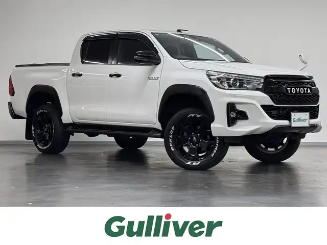 トヨタ ハイラックス Z ブラックラリーエディション 三重県 2019(平31)年 6.2万km スーパーホワイトⅡ ディーゼル・ターボ/パートタイム4WD/MTモード付フロア6AT/純正 7インチナビ NSZT-W68T/（AM/FM/CD/DVD/TV/SD/SDREC/Bluetooth）/バックガイドモニター/ETC2.0/Toyota Safety Sense/●プリクラッシュセーフティ/●レーンディパーチャーアラート/・ダウンヒルアシストコントロール［DAC］/・ヒルスタートアシストコントロール［HAC］/・EBD（電子制動力配分制御）付ABS＆ブレーキアシスト/・VSC＆TRC/・緊急ブレーキシグナル/装備/●【DOP】ユーティリティパッケージB/●ソフトトノカバー/●ベッドライナー/・クルーズコントロール/・オートエアコン/・プッシュスタート/・オートライト/・LEDヘッドランプ/・フロント＆リヤフォグランプ/・ブラックラリーED専用 18inAW（ブラック塗装）＋ホワイトレタータイヤ/・スマートキーx2、リモコンエンジンスターターx1/・純正フロントグリルあり/・保/取